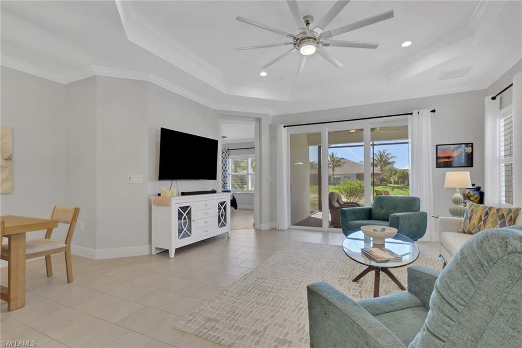 2194 Marquesa Circle Naples, FL 34112 - Photo 10 of 38 a living room with furniture and a flat screen tv