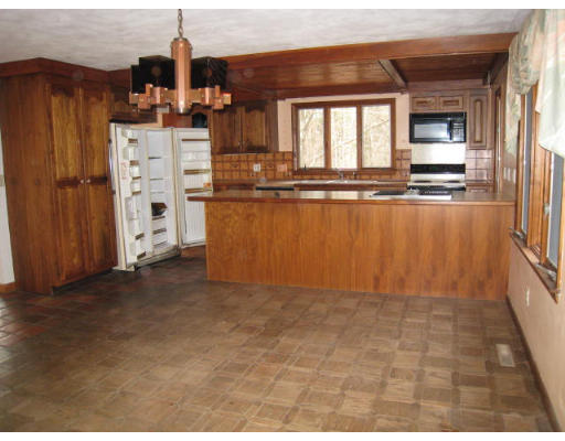 5 Wayside Inn Road Framingham, MA 01701 - Photo 6 of 11 a view of a kitchen with a window