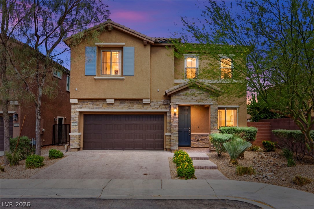 A traditional facade with stone accents and inviting entrance, offering comfortable living.