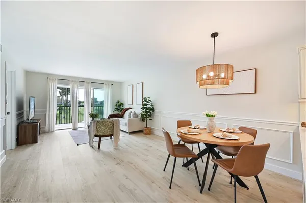 a view of a dining room with furniture window and outside view