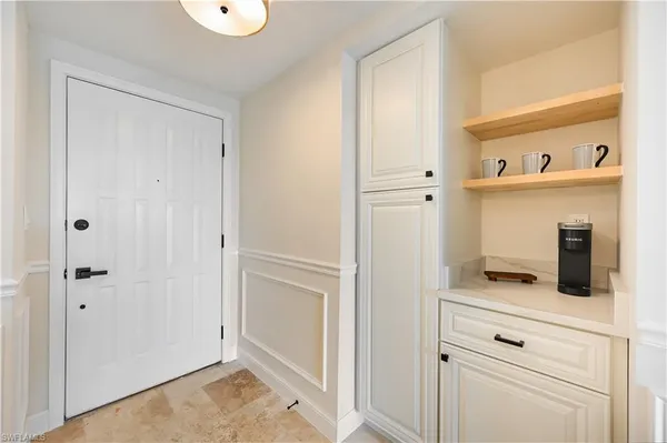 a kitchen that has a lot of cabinets in it