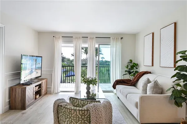 a living room with furniture fireplace and a flat screen tv