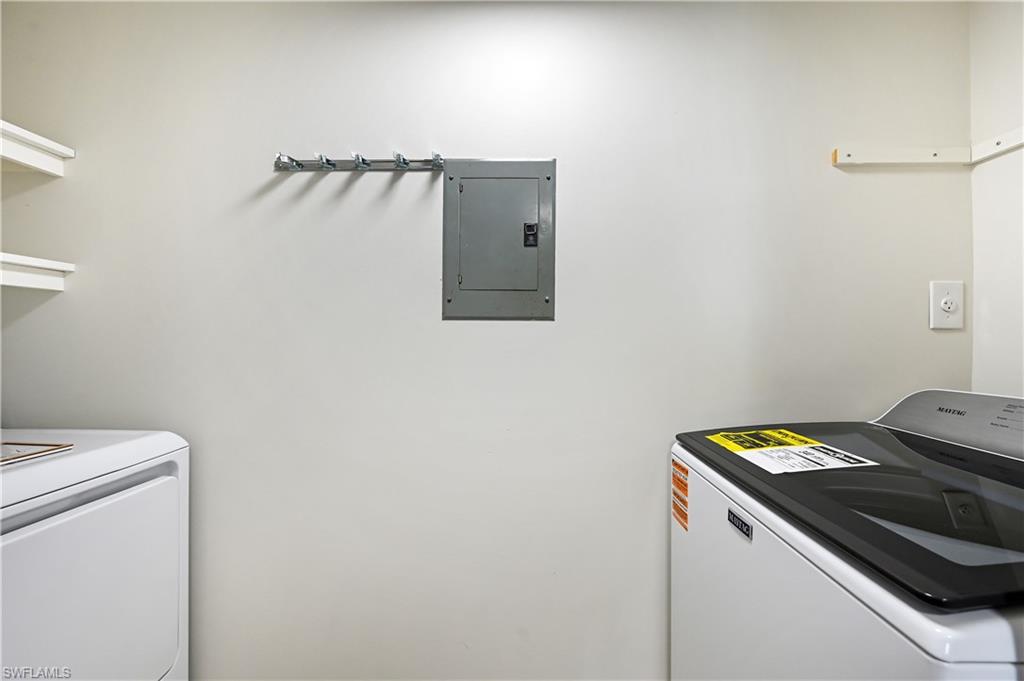 190 Pebble Beach Boulevard, Unit 202 Naples, FL 34113 - Photo 31 of 36 a utility room with dryer and washer