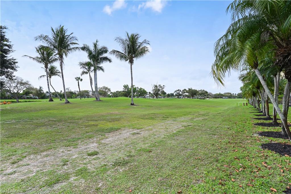 190 Pebble Beach Boulevard, Unit 202 Naples, FL 34113 - Photo 34 of 36 a view of a park with palm trees