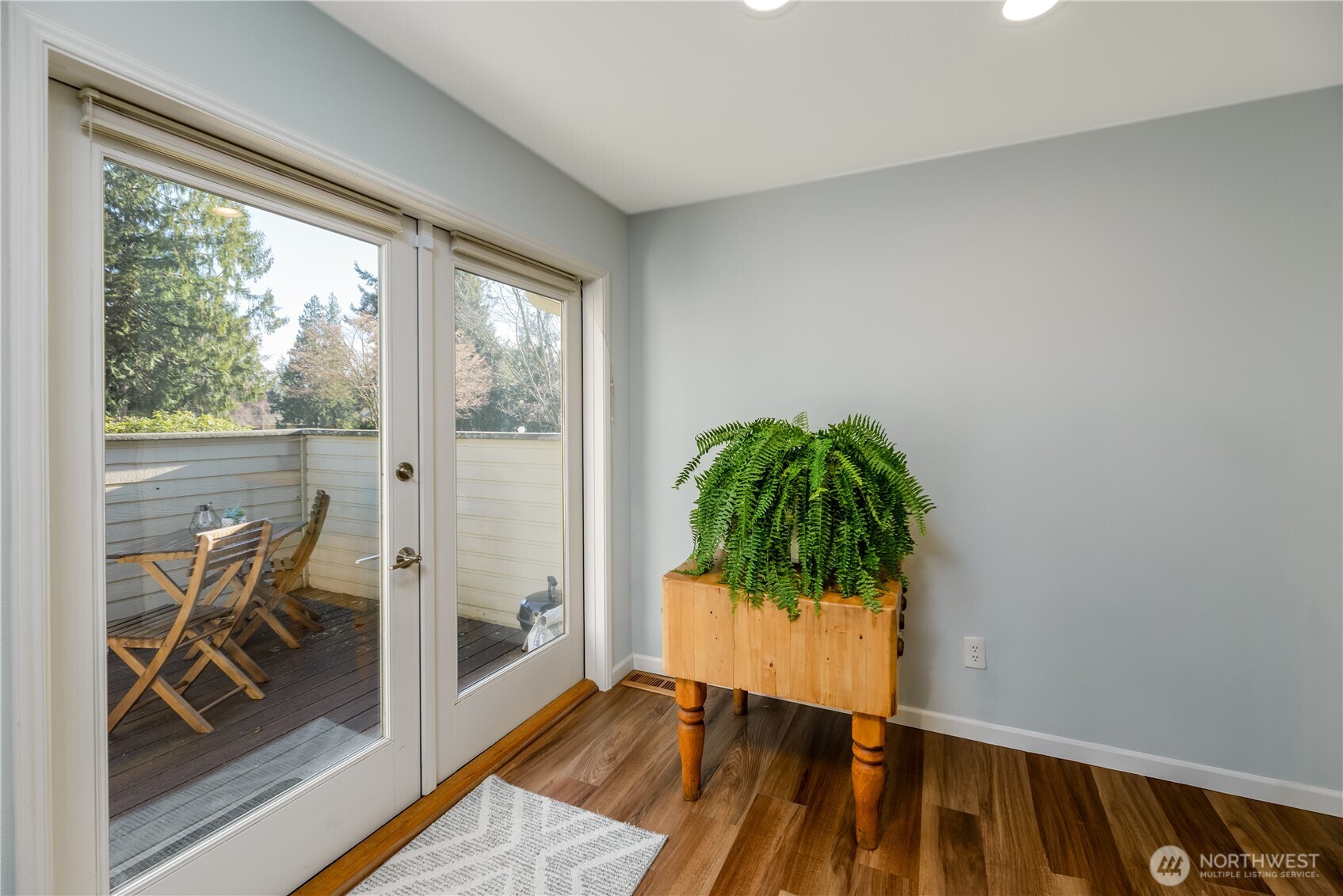 115 Fairway Drive Sequim, WA 98382 - Photo 18 of 39 a view of a room with wooden floor and a potted plant