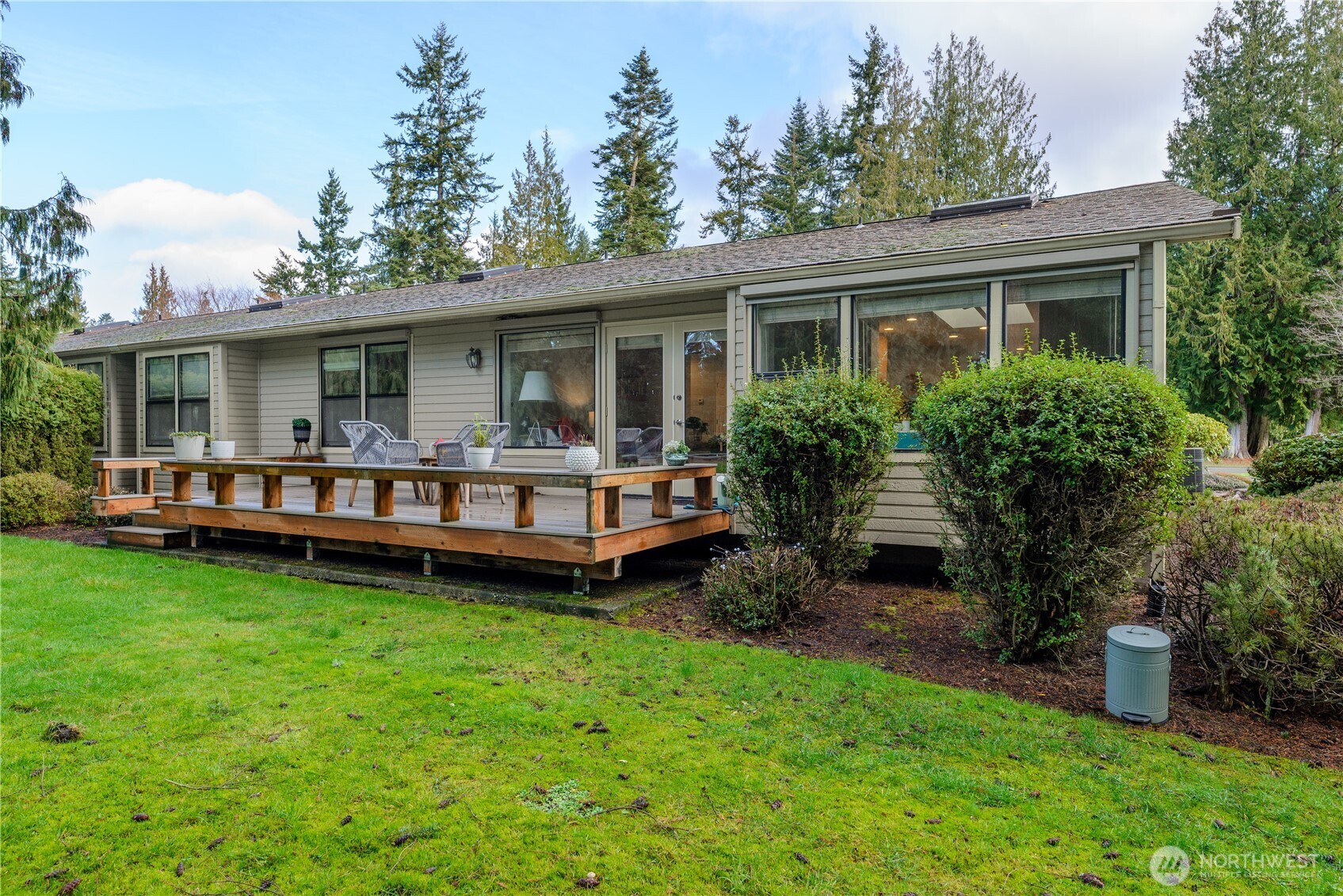115 Fairway Drive Sequim, WA 98382 - Photo 36 of 39 a view of a house with a backyard and a patio