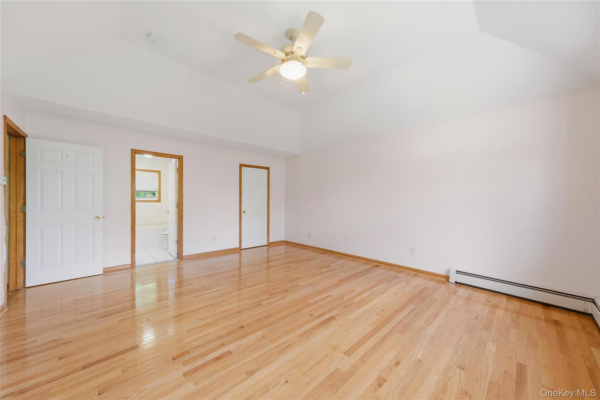5 Horton Road Washingtonville, NY 10992 - Photo 19 of 42 wooden floor in an empty room with a window