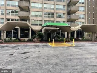 a view of a building with a swimming pool