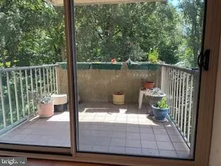 a view of a balcony with chair