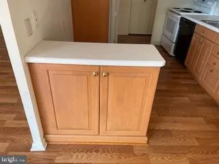 a view of a kitchen with wooden floor