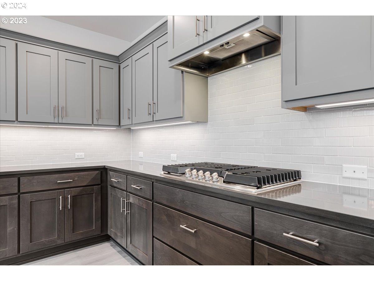 17127 Southwest Kalapuya Lane Sherwood, OR 97140 - Photo 3 of 18 a kitchen with cabinets and appliances