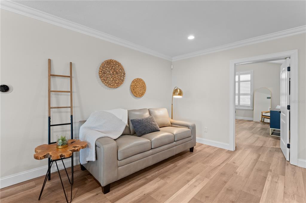 3300 Floramar Terrace New Port Richey, FL 34652 - Photo 11 of 75 a living room with furniture and a wooden floor