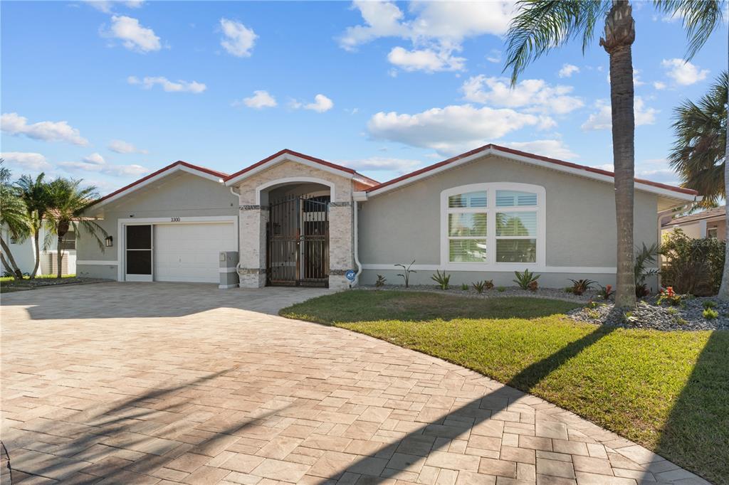 3300 Floramar Terrace New Port Richey, FL 34652 - Photo 2 of 75 a front view of a house with swimming pool
