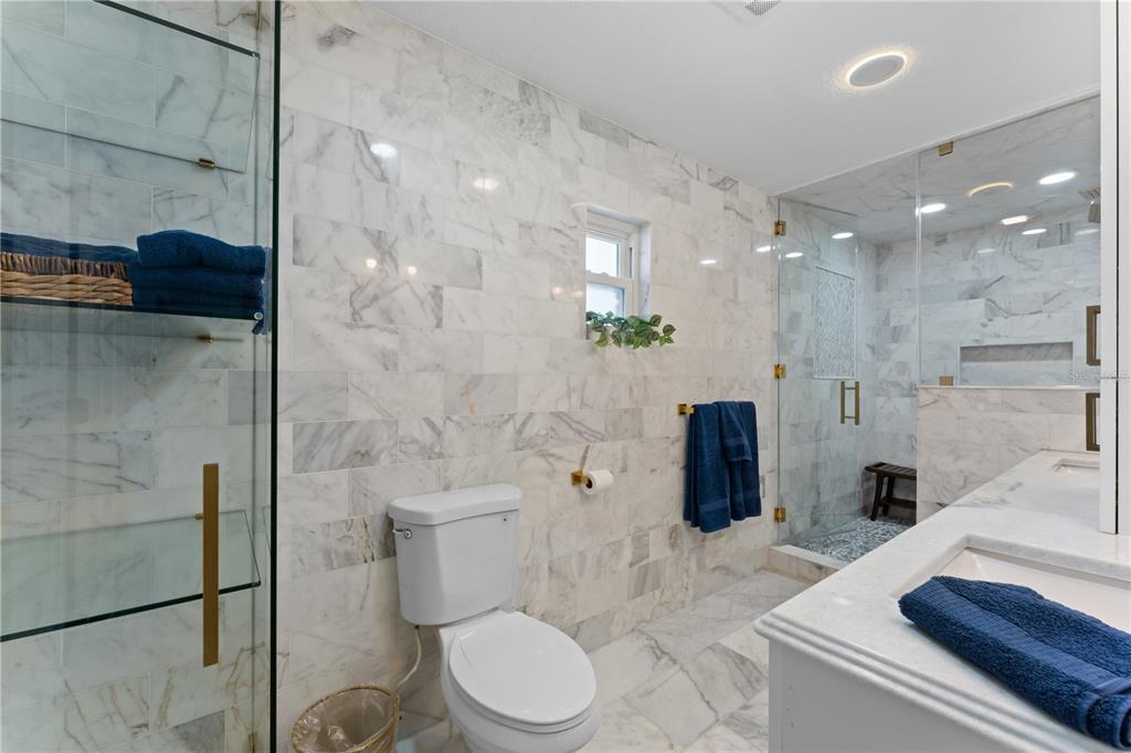 3300 Floramar Terrace New Port Richey, FL 34652 - Photo 21 of 75 a bathroom with a sink a toilet and shower