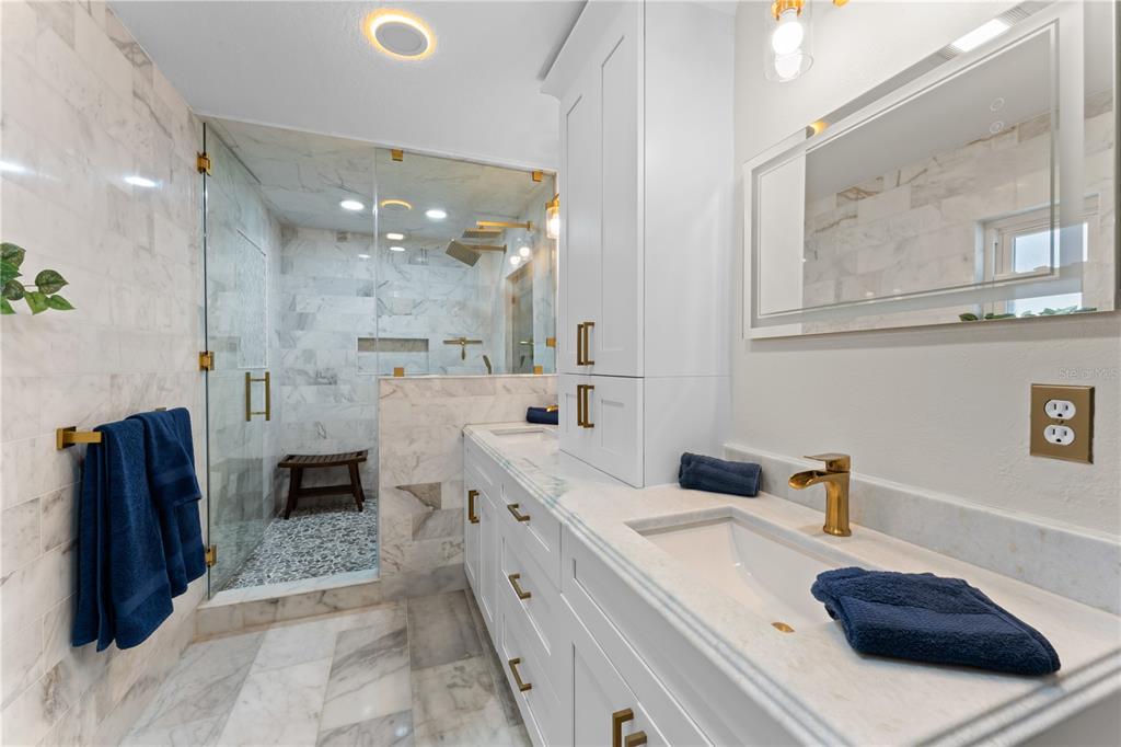 3300 Floramar Terrace New Port Richey, FL 34652 - Photo 23 of 75 a bathroom with a sink a toilet and shower