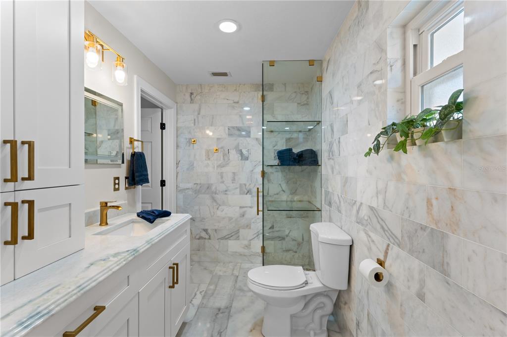 3300 Floramar Terrace New Port Richey, FL 34652 - Photo 26 of 75 a bathroom with a sink toilet and shower