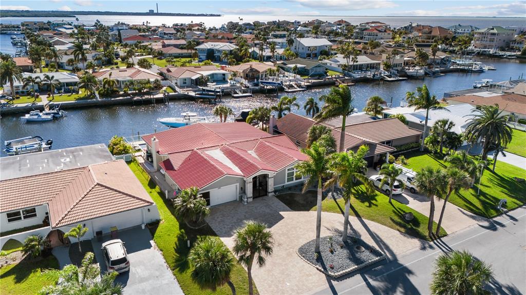 3300 Floramar Terrace New Port Richey, FL 34652 - Photo 3 of 75 an aerial view of residential houses with outdoor space and lake view