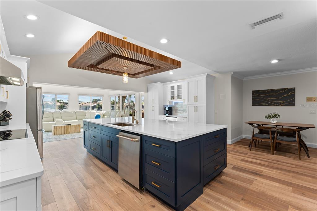 3300 Floramar Terrace New Port Richey, FL 34652 - Photo 32 of 75 a kitchen with a sink and wooden floor