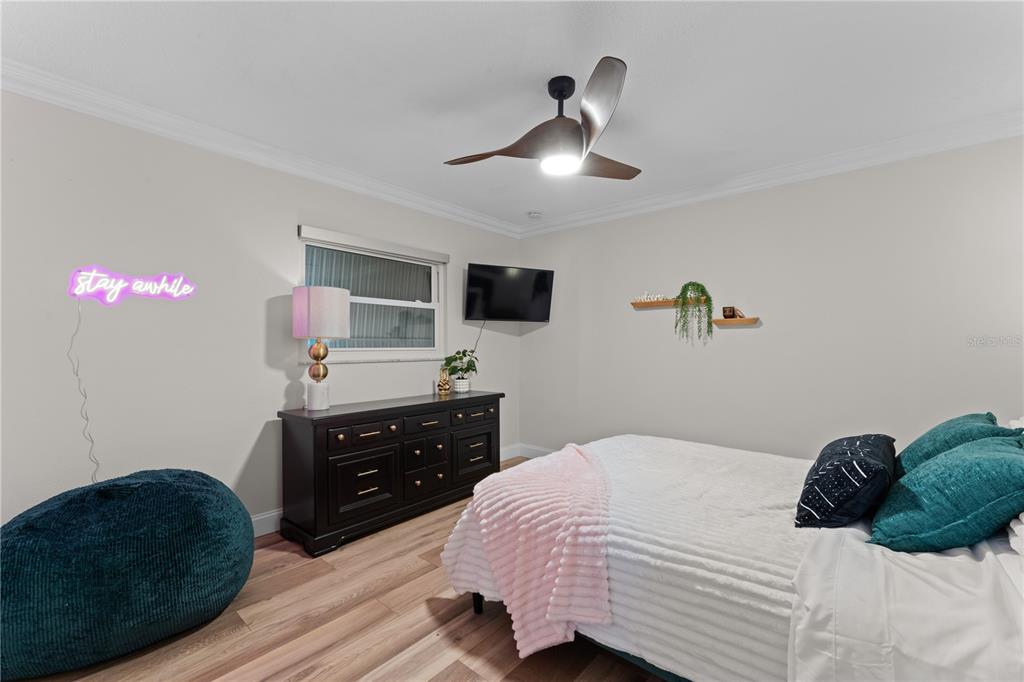 3300 Floramar Terrace New Port Richey, FL 34652 - Photo 33 of 75 a bedroom with a bed and a dresser