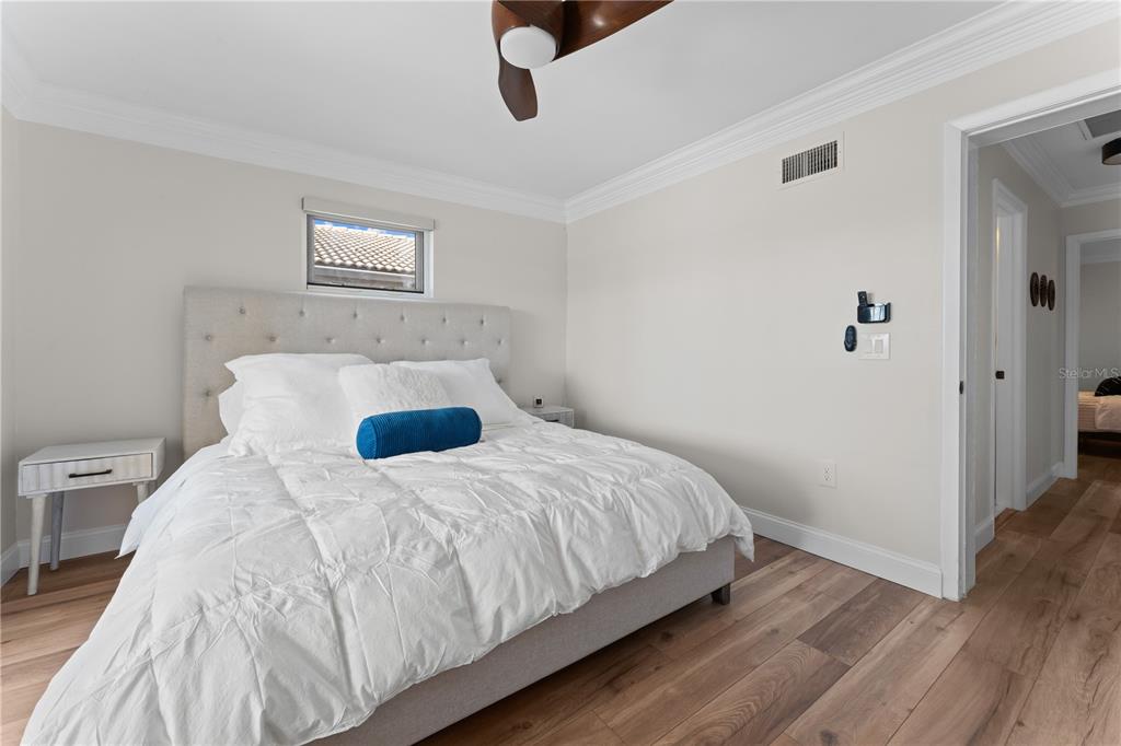 3300 Floramar Terrace New Port Richey, FL 34652 - Photo 38 of 75 a bedroom with a bed and a window