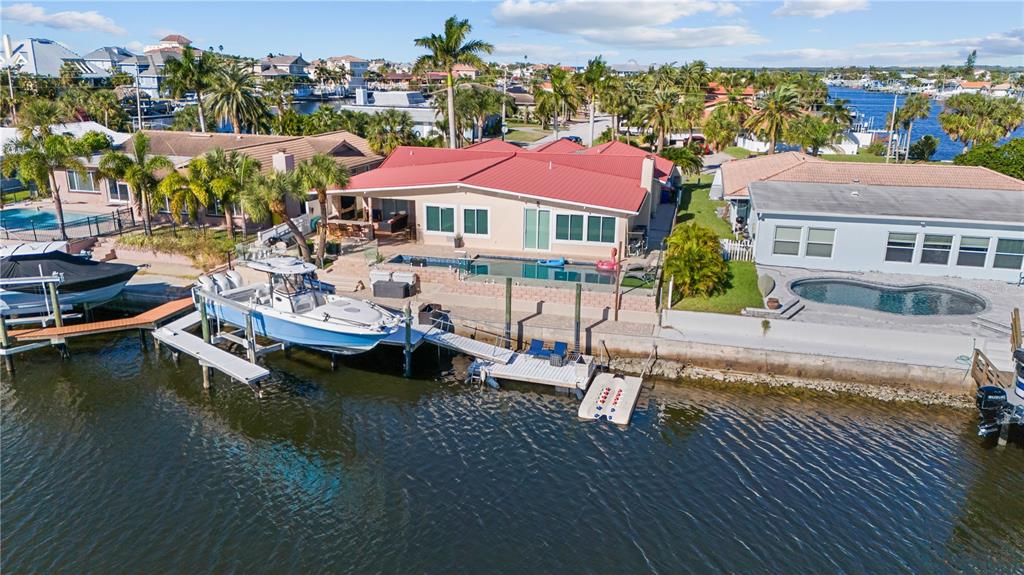 3300 Floramar Terrace New Port Richey, FL 34652 - Photo 5 of 75 an aerial view of a house with swimming pool patio and outdoor seating