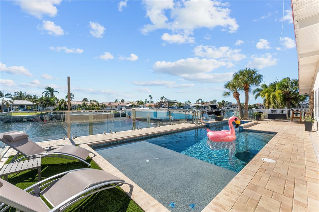 3300 Floramar Terrace New Port Richey, FL 34652 - Photo 69 of 75 a balcony with chairs and lake view