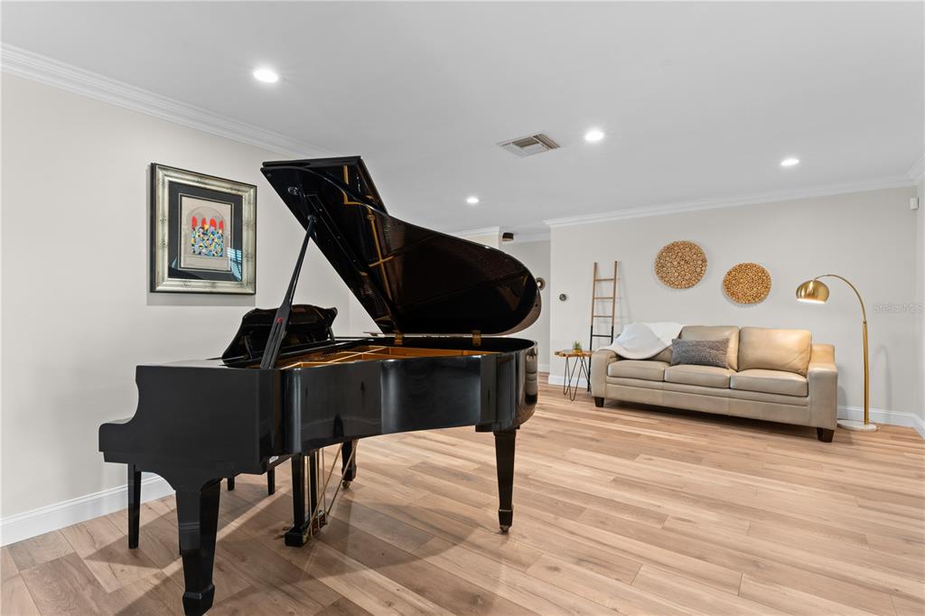 3300 Floramar Terrace New Port Richey, FL 34652 - Photo 10 of 75 a living room with furniture and a wooden floor