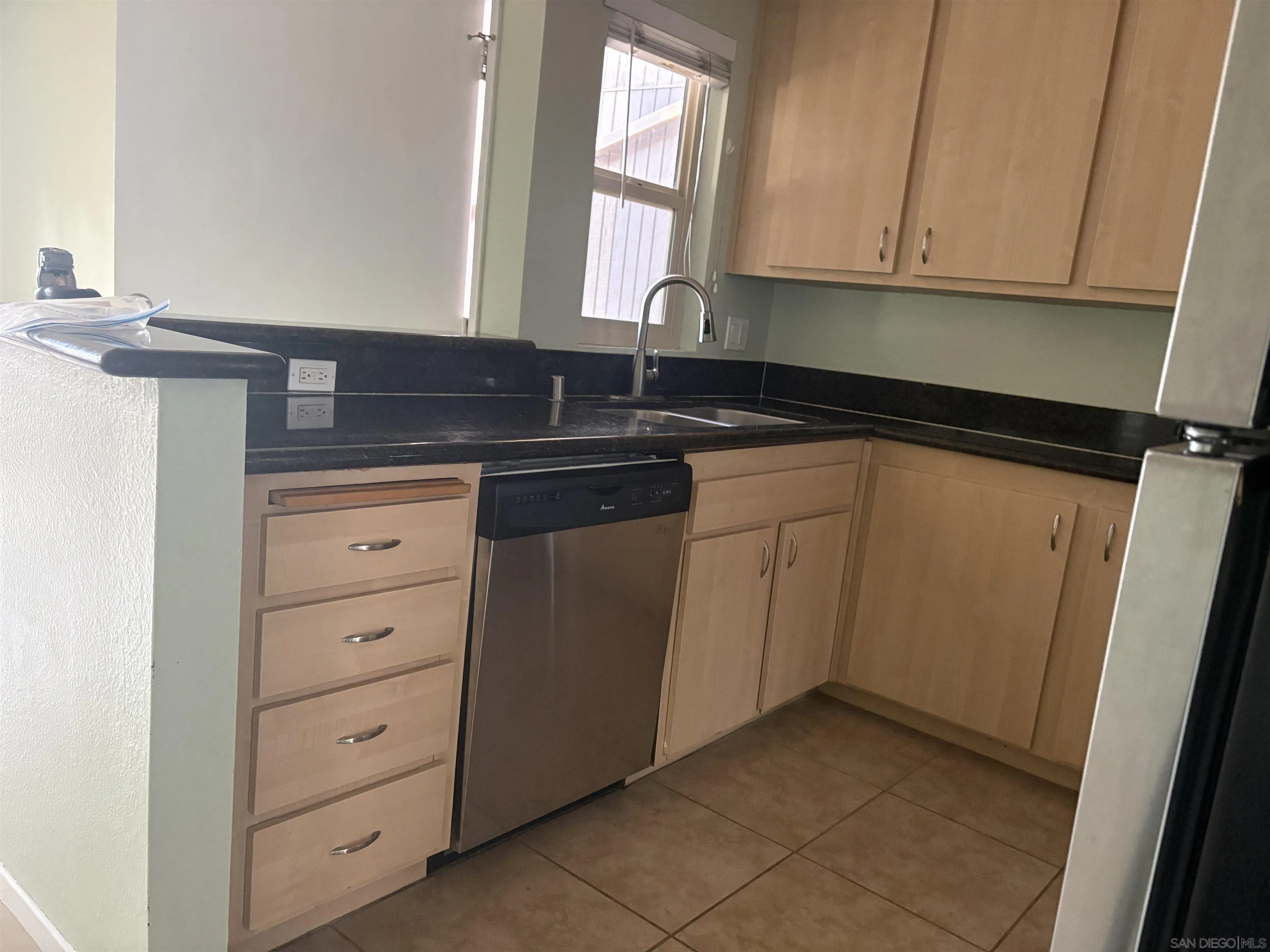 5962 Rancho Mission Road, Unit 222 San Diego, CA 92108 - Photo 18 of 42 a kitchen with cabinets appliances and a sink