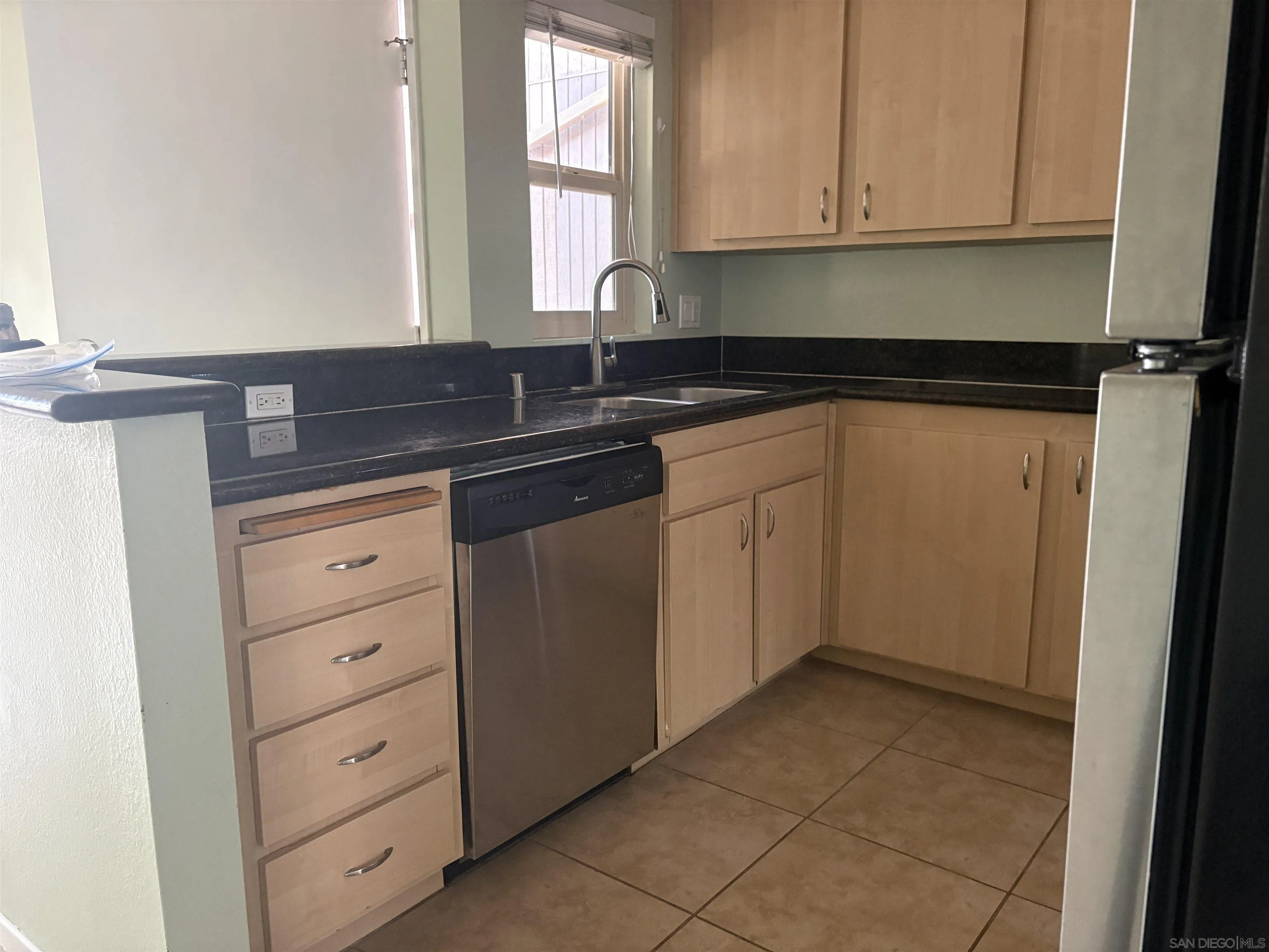5962 Rancho Mission Road, Unit 222 San Diego, CA 92108 - Photo 19 of 42 a kitchen with a sink and cabinets