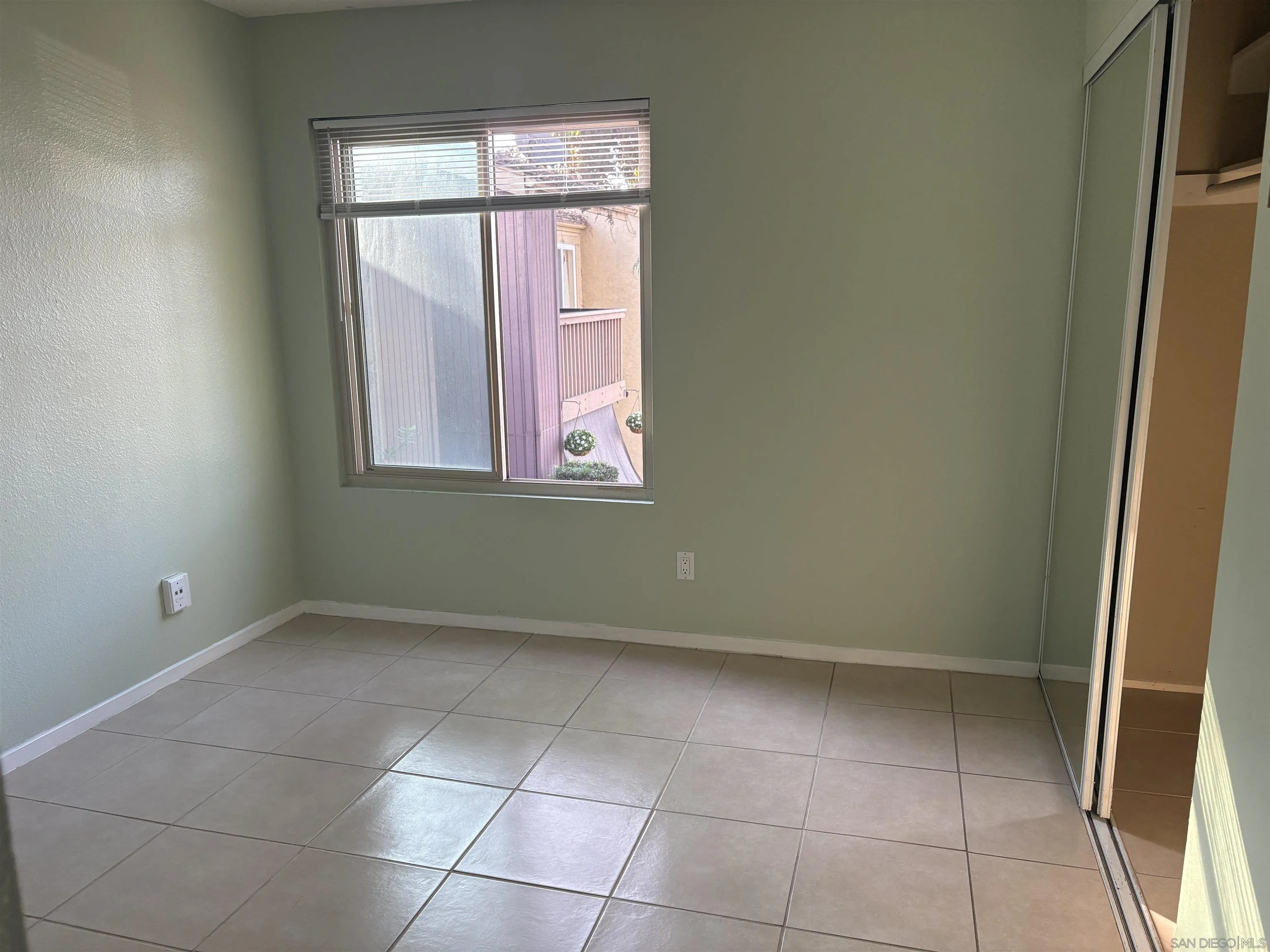 5962 Rancho Mission Road, Unit 222 San Diego, CA 92108 - Photo 26 of 42 a view of an empty room with a window