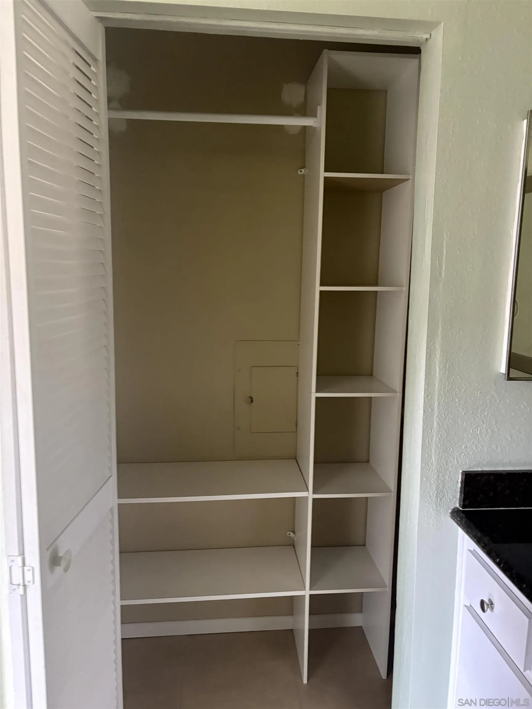 5962 Rancho Mission Road, Unit 222 San Diego, CA 92108 - Photo 31 of 42 a view of walk in closet with empty racks