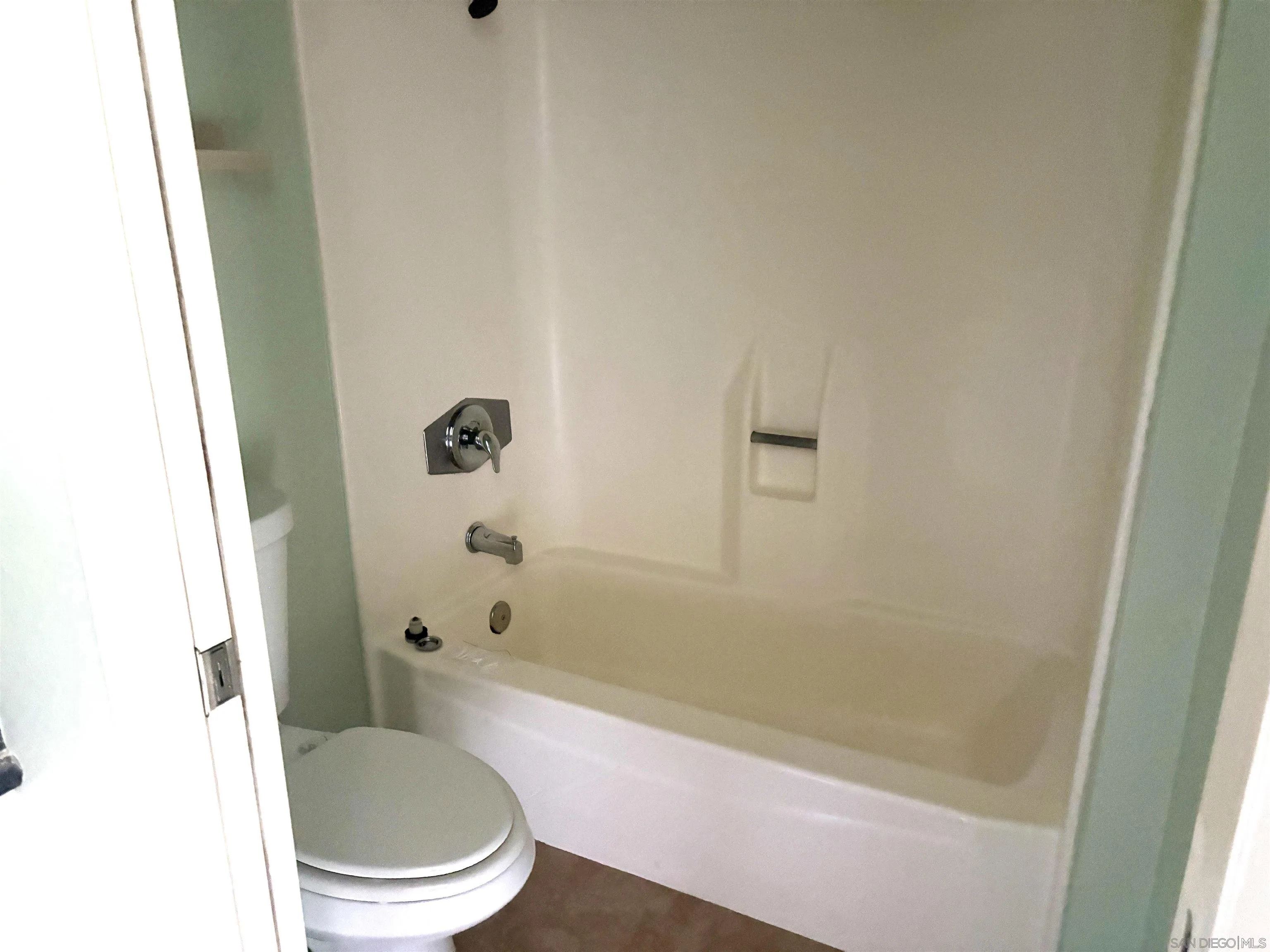 5962 Rancho Mission Road, Unit 222 San Diego, CA 92108 - Photo 33 of 42 a bathroom with a toilet and a shower