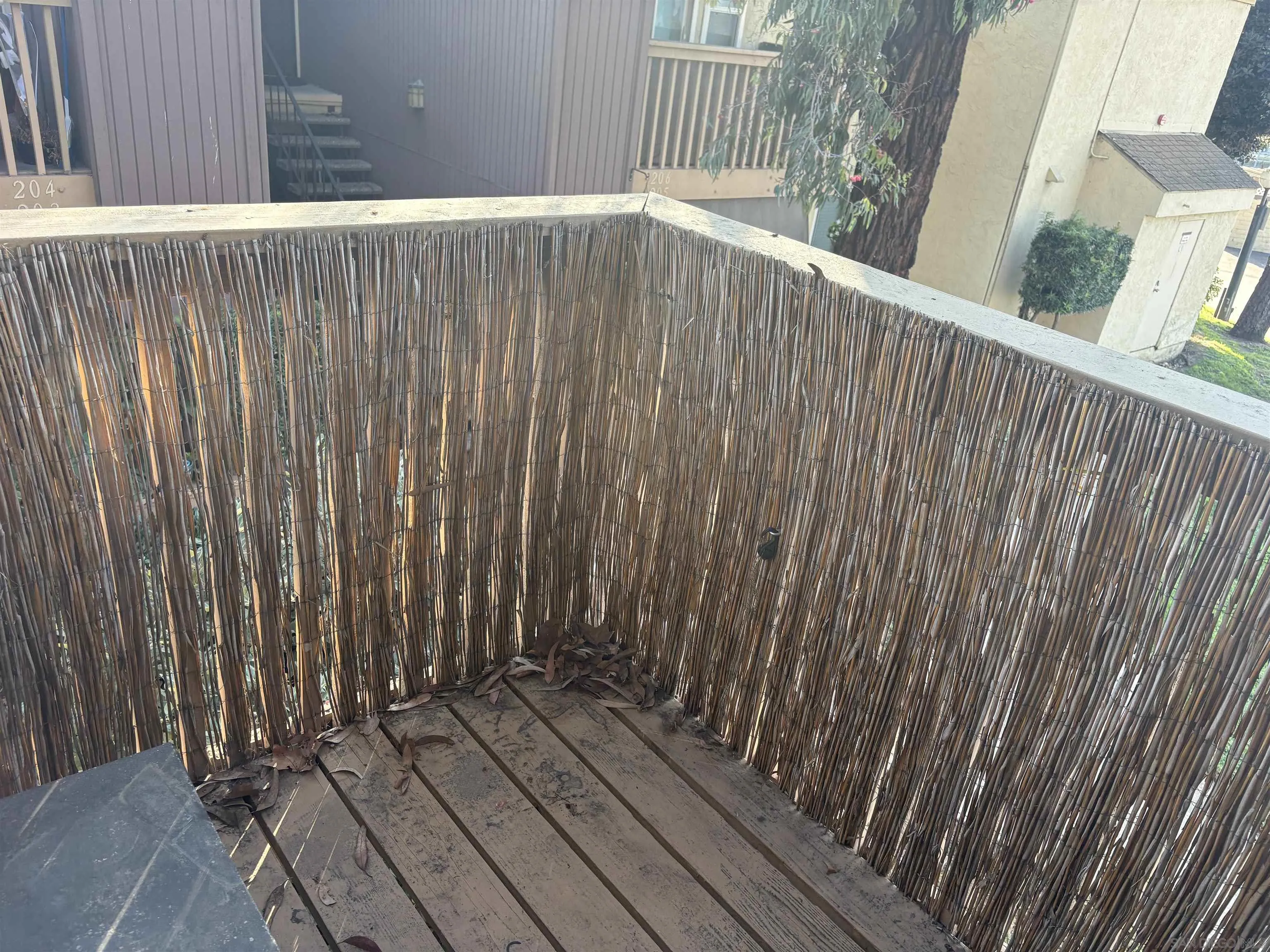 5962 Rancho Mission Road, Unit 222 San Diego, CA 92108 - Photo 37 of 42 a view of outdoor space with wooden fence