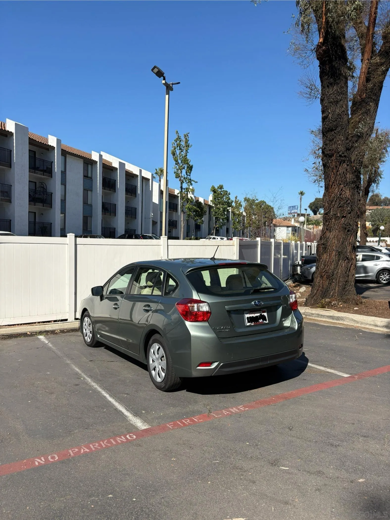 5962 Rancho Mission Road, Unit 222 San Diego, CA 92108 - Photo 42 of 42 a view of a car parked in front of a house