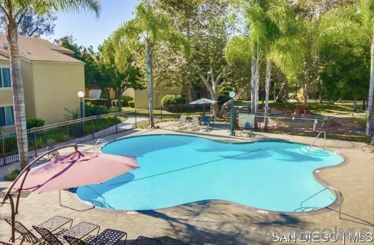 5962 Rancho Mission Road, Unit 222 San Diego, CA 92108 - Photo 7 of 42 a view of a swimming pool with a patio