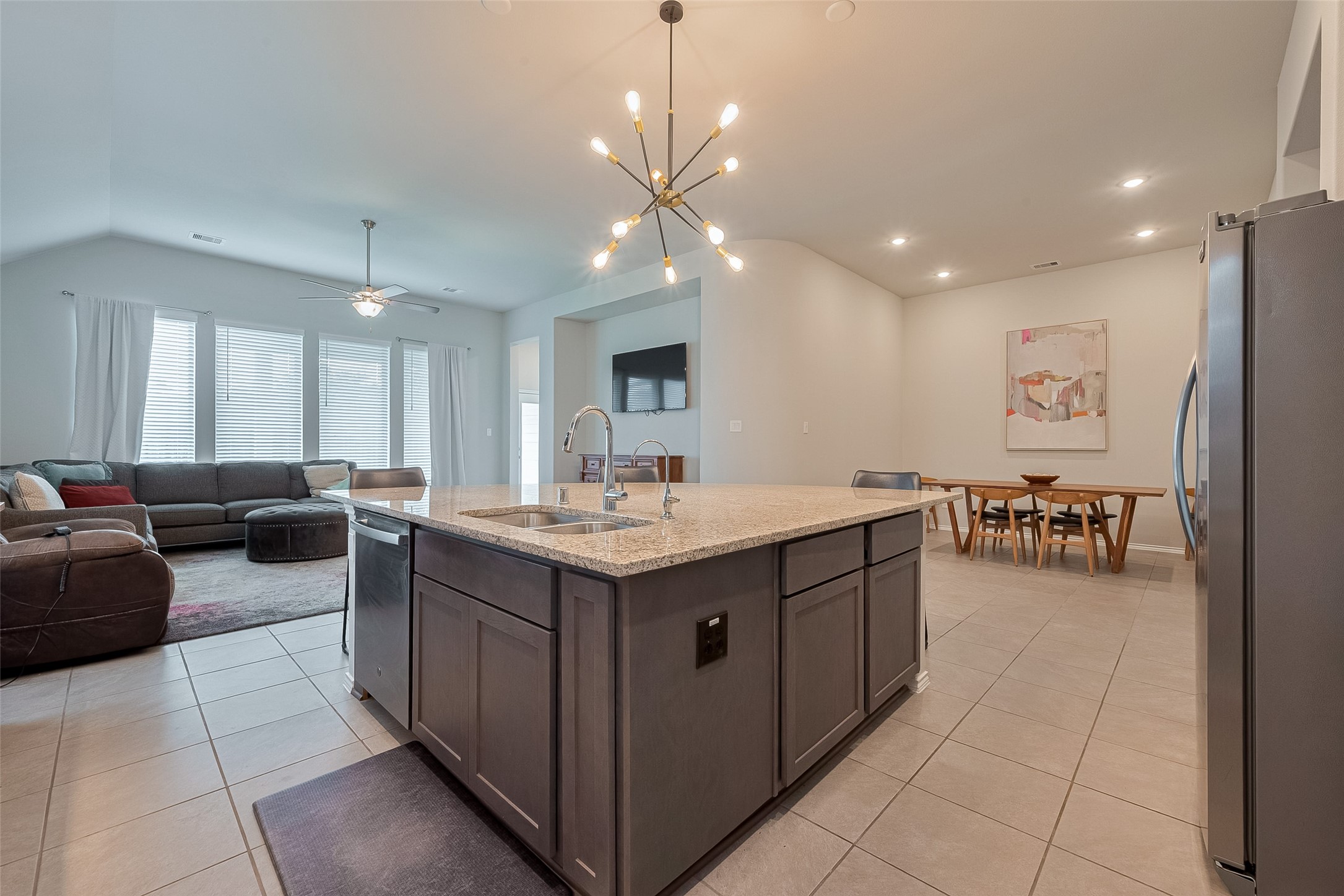 25446 Fossa Drive Tomball, TX 77375 - Photo 11 of 29 a living room with couches and kitchen view with wooden floor