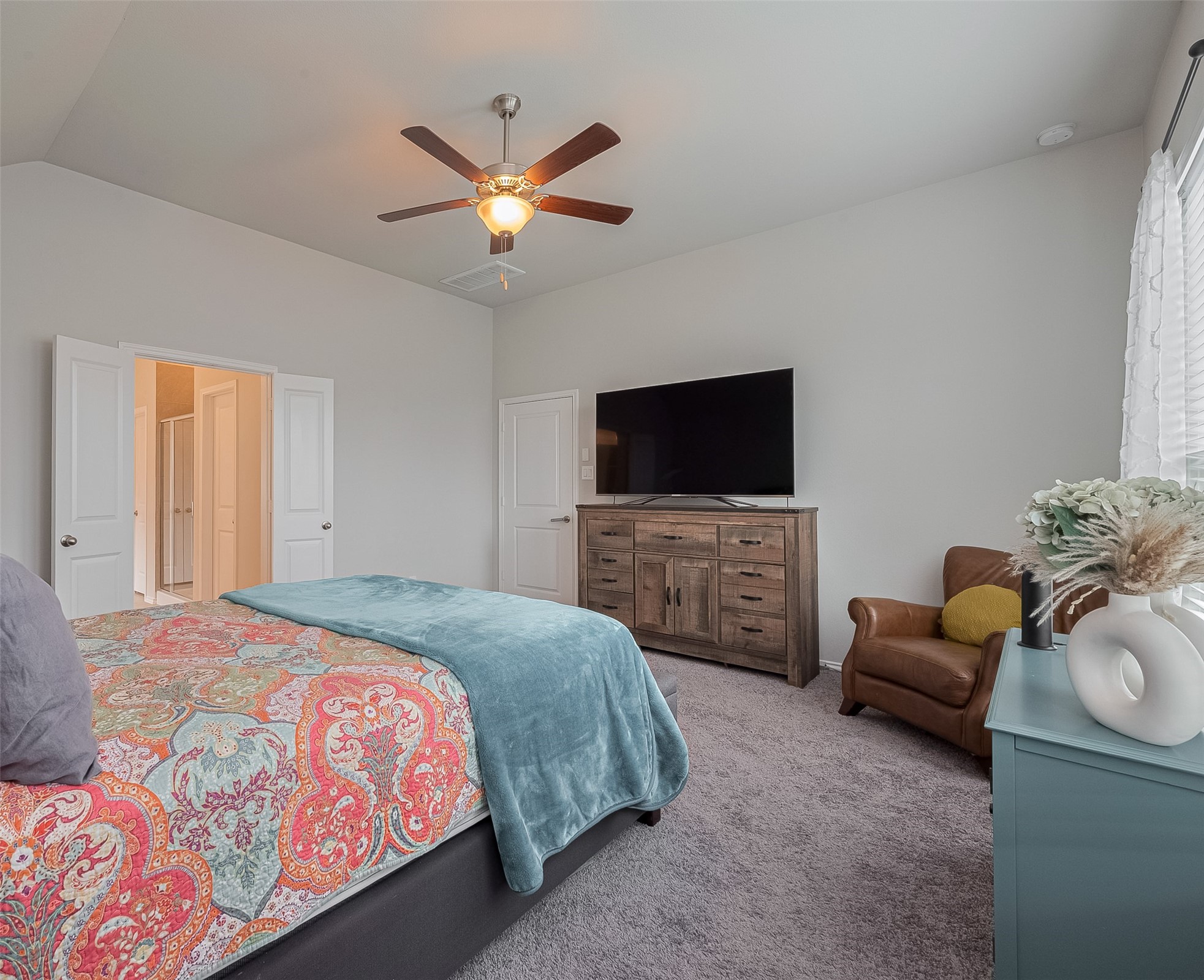 25446 Fossa Drive Tomball, TX 77375 - Photo 14 of 29 a bedroom with a bed and a flat screen tv