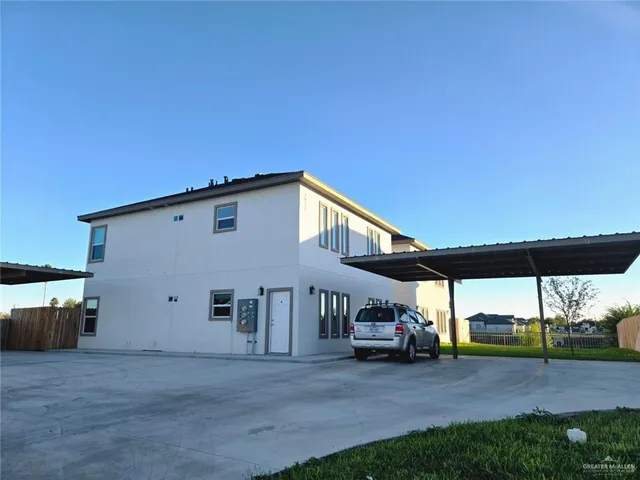 a view of a house with a big yard