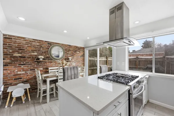 a kitchen with a table and chairs in it