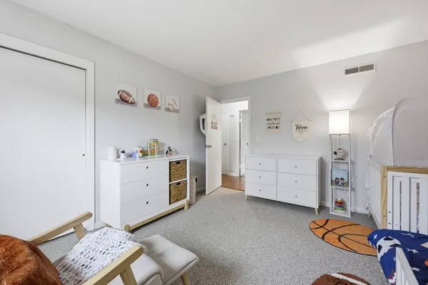 a room with furniture and a dresser