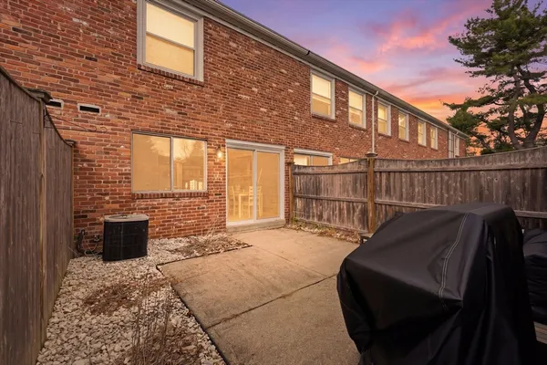 a view of a chair and table in the patio