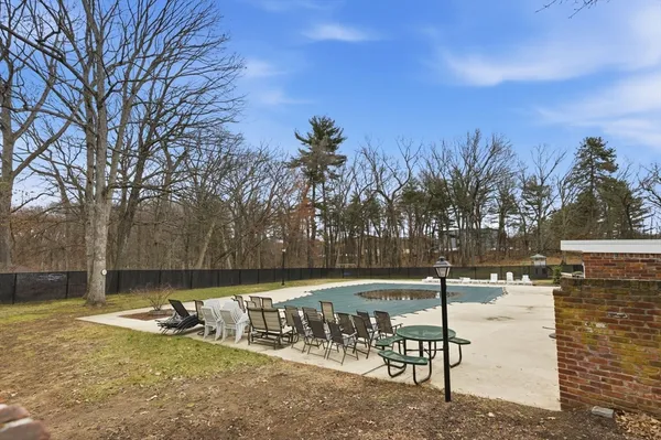 a view of a playground with a house
