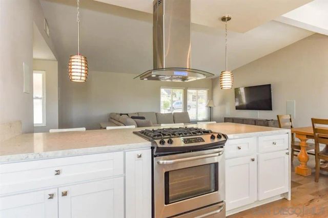 a kitchen with a stove and a microwave