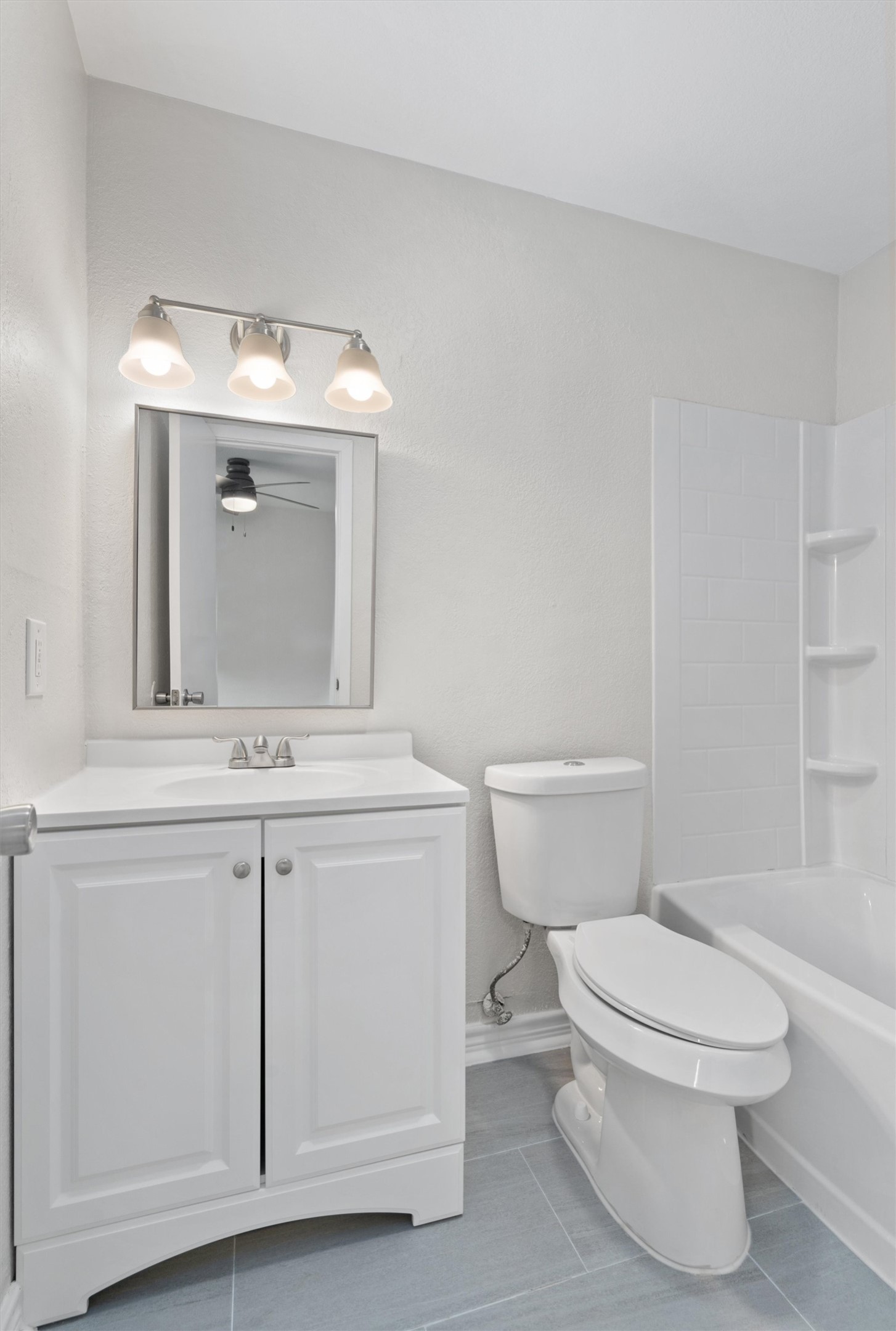 2532 Chaparral Trail Austin, TX 78744 - Photo 14 of 27 a bathroom with a toilet sink vanity and mirror