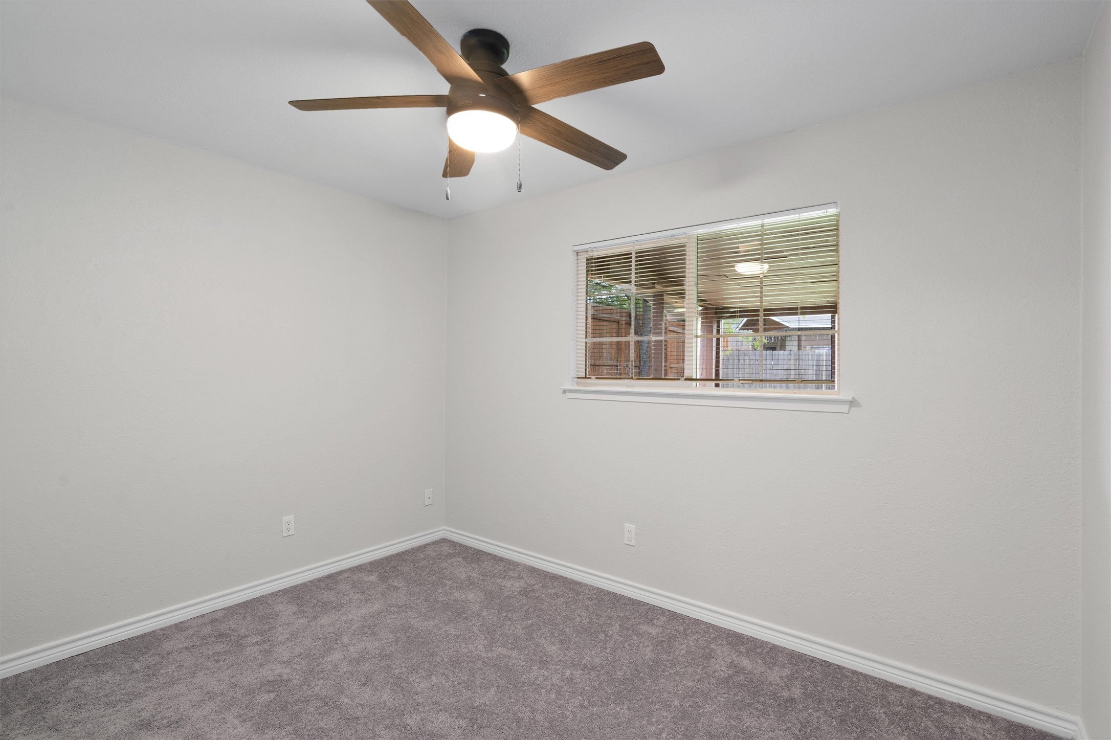 2532 Chaparral Trail Austin, TX 78744 - Photo 18 of 27 an empty room with a window and a fan