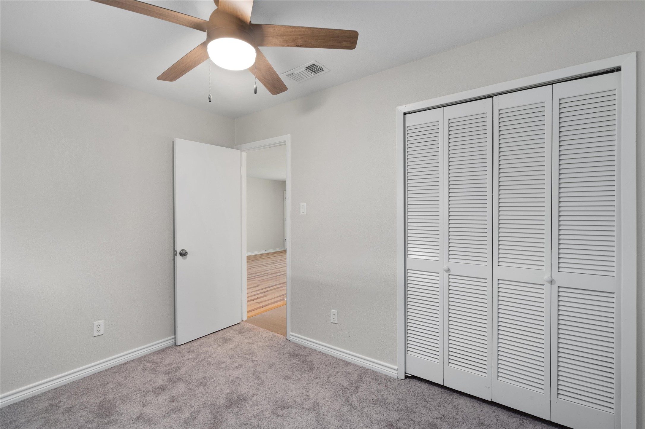 2532 Chaparral Trail Austin, TX 78744 - Photo 19 of 27 wooden floor in an empty room