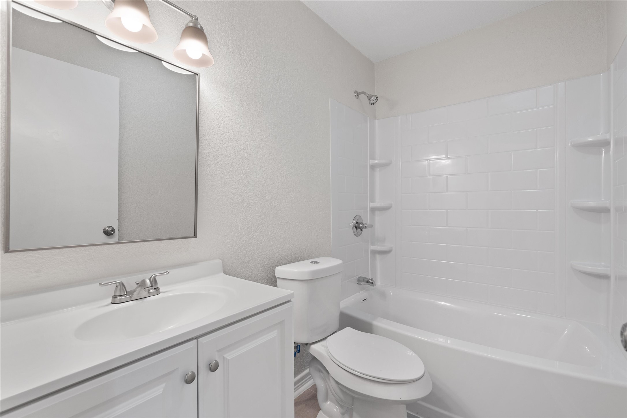 2532 Chaparral Trail Austin, TX 78744 - Photo 20 of 27 a bathroom with a sink toilet and shower