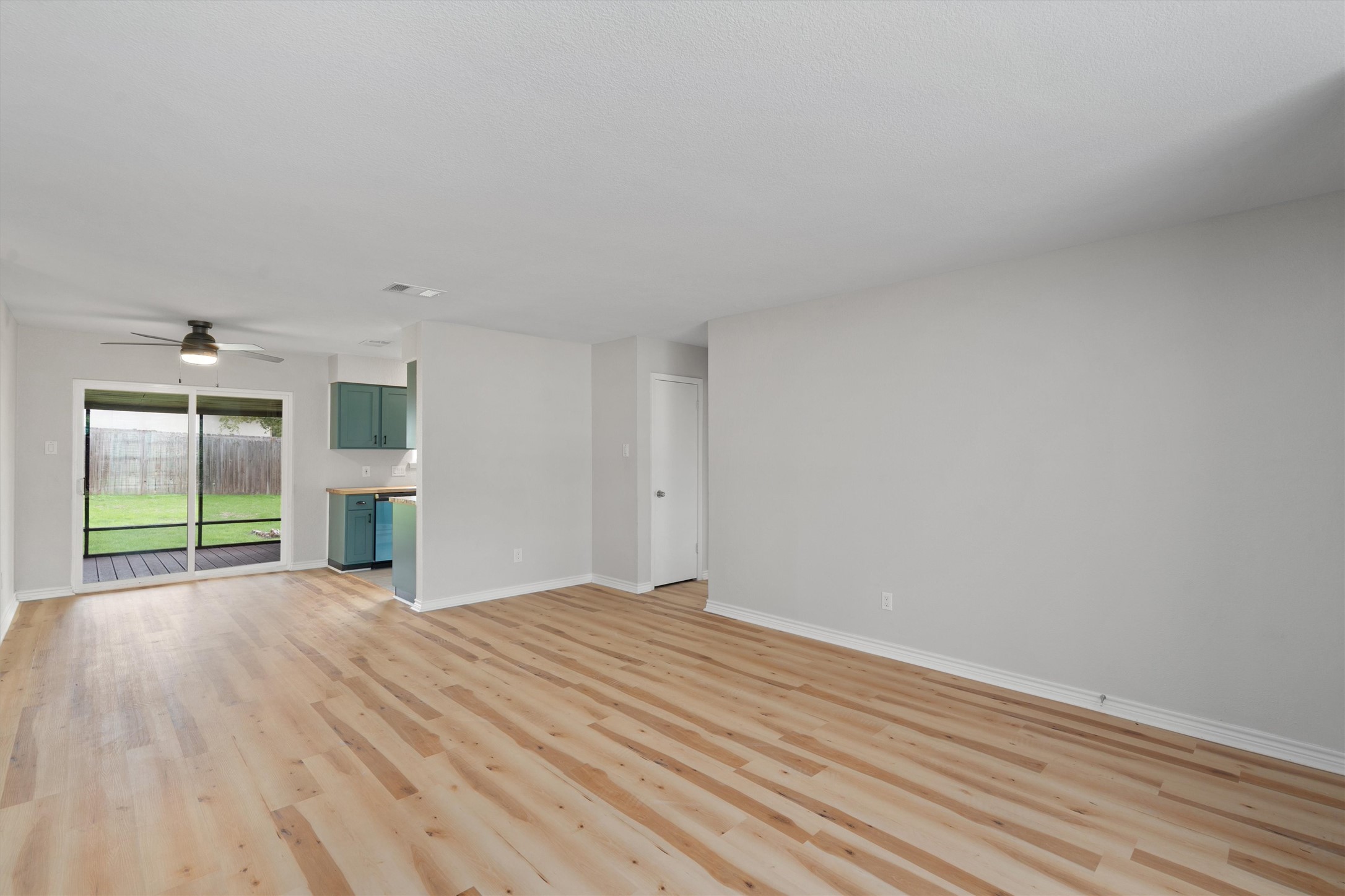 2532 Chaparral Trail Austin, TX 78744 - Photo 6 of 27 a view of an empty room with wooden floor