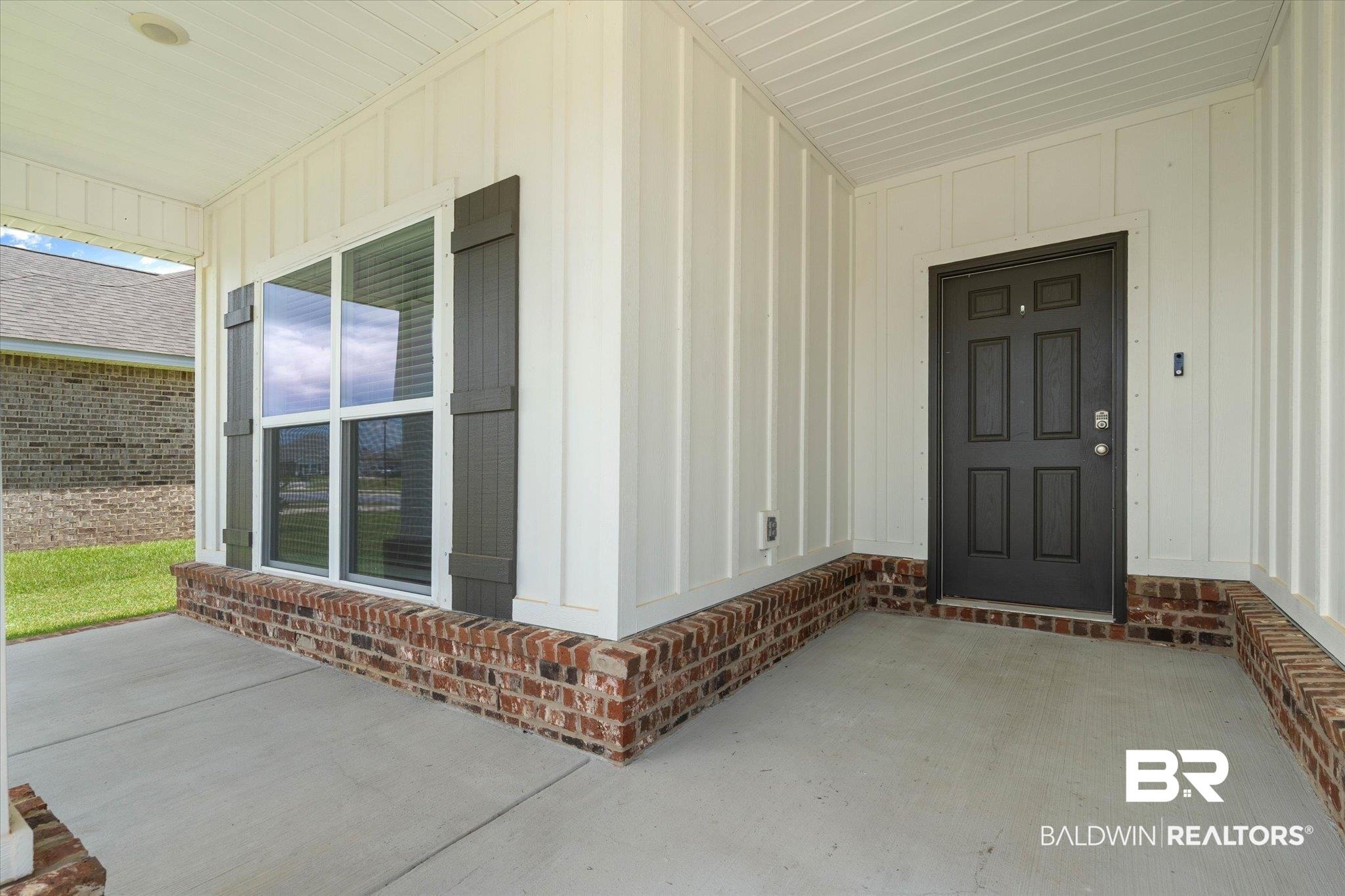 11229 Genuine Risk Circle Daphne, AL 36526 - Photo 2 of 46 Property entrance with a porch and board and batten siding