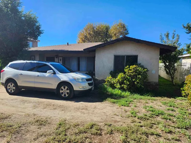 a house view with a garden space